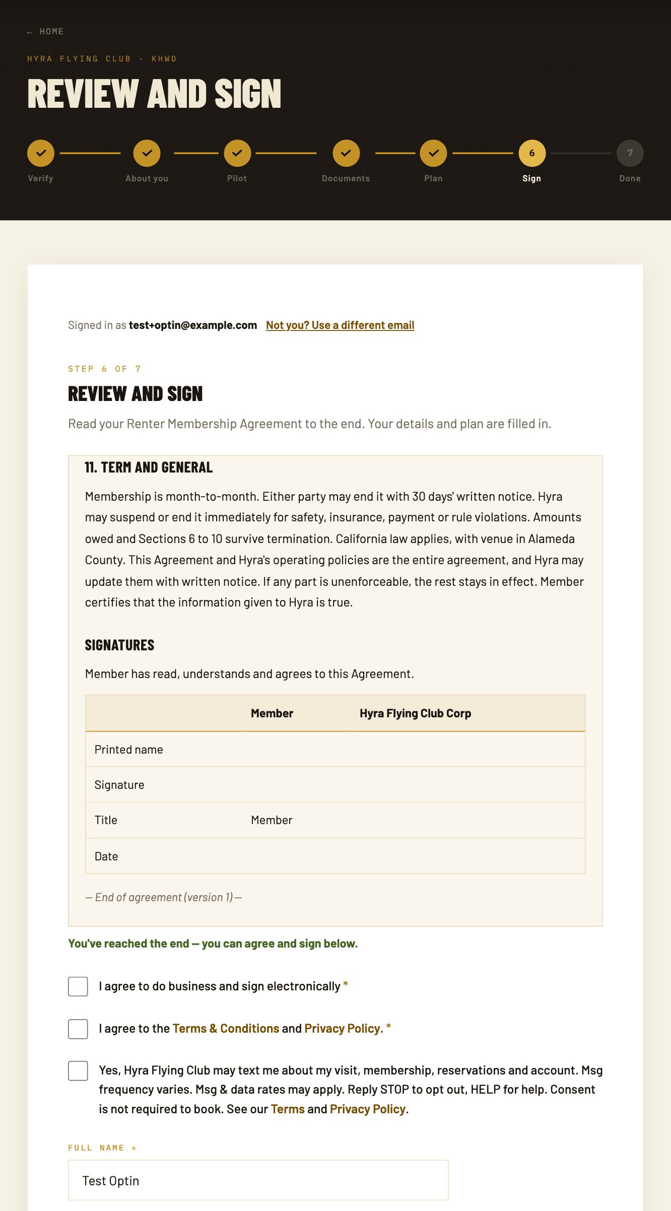Sign-up step 6, Review and sign: the end of the membership agreement, then two required checkboxes and the optional, unchecked SMS consent checkbox.